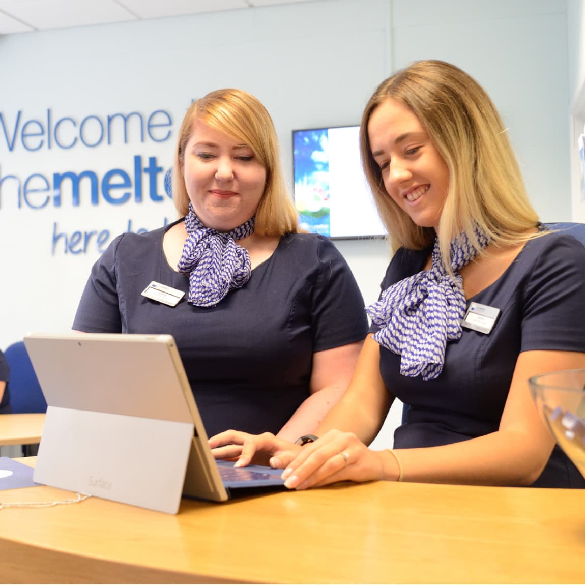 Two women working in a bank