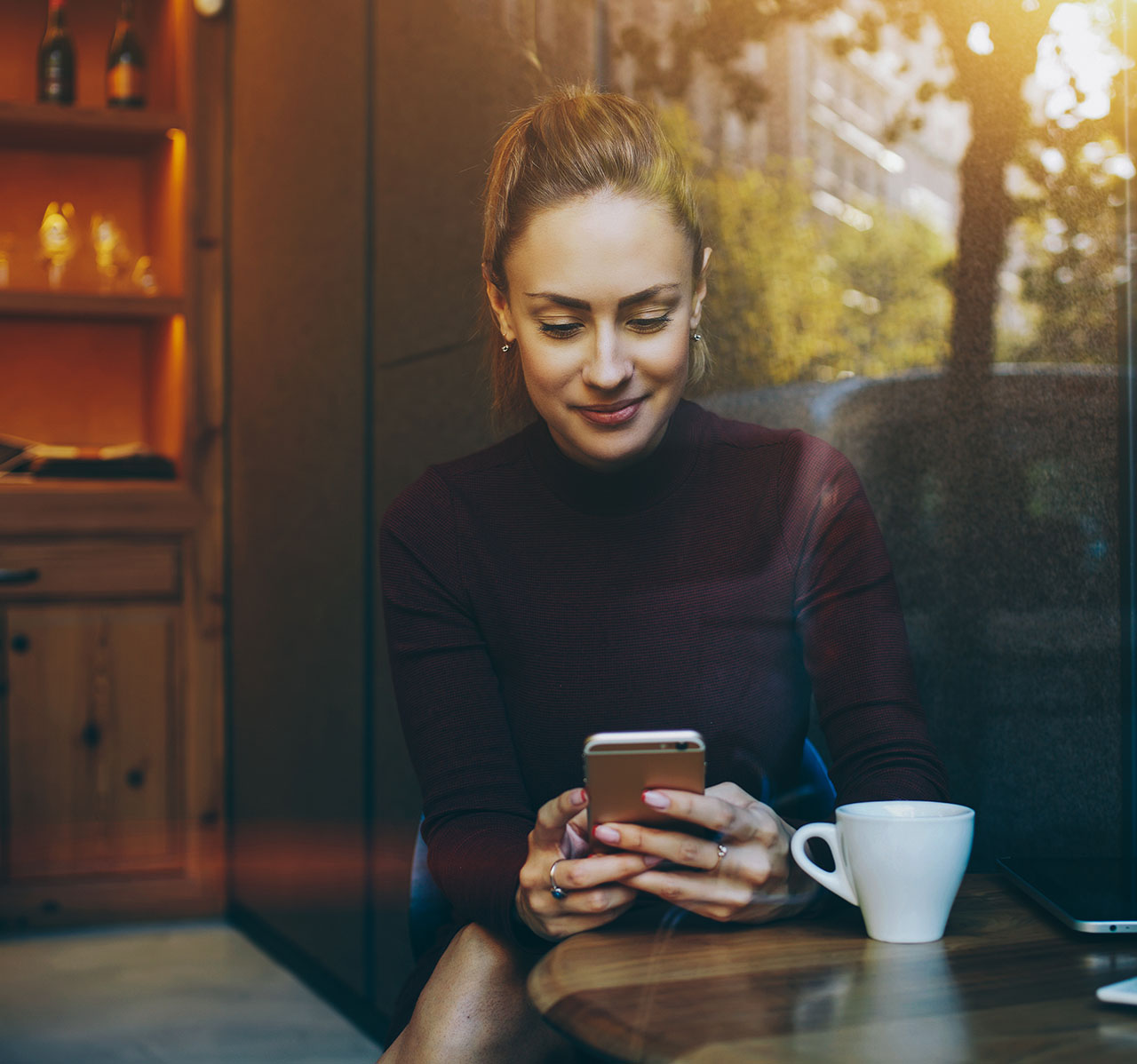 A woman looking at a phone